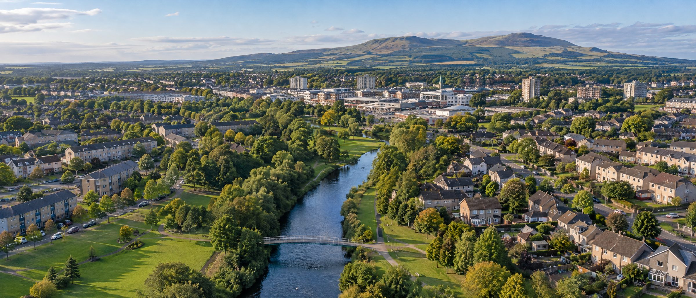 Aerial view of Glenrothes with the River Leven, Riverside Park, homes and the Lomond Hills